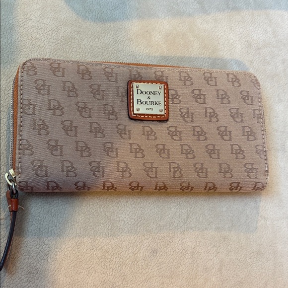 Dooney & Bourke Handbags - Dooney & Bourke Beige Logo Wallet GUC. 8” x 4.25” x 1”